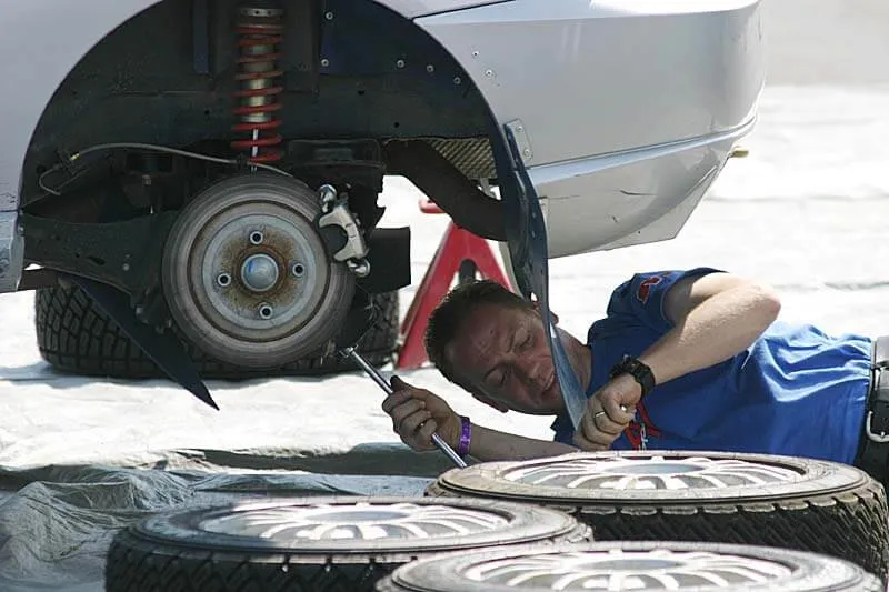 Person repairing an automobile