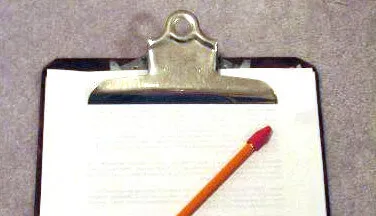 Clipboard with a pencil