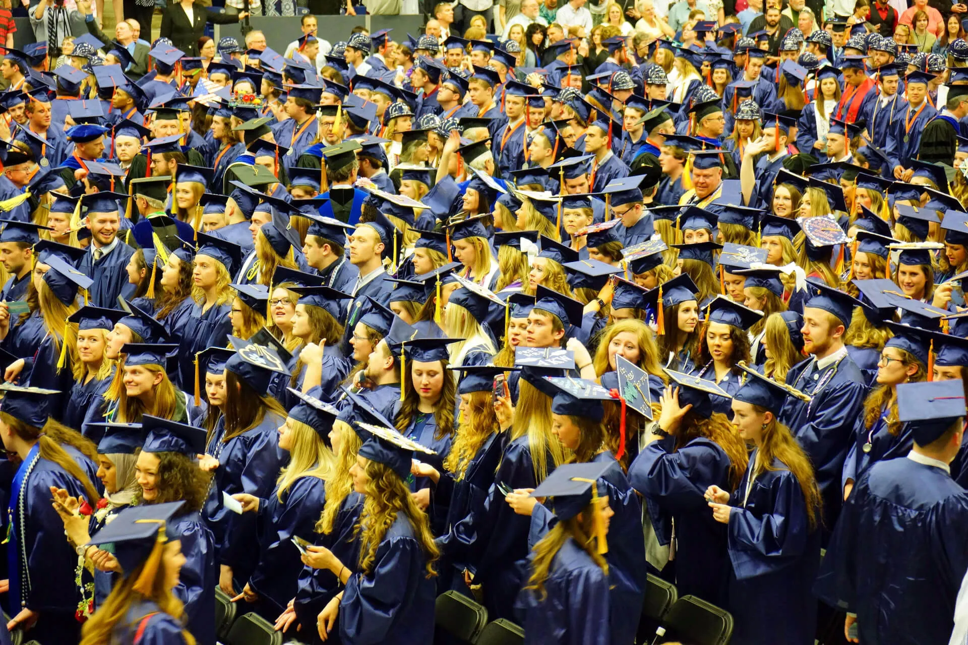 Students at graduation in caps and gowns